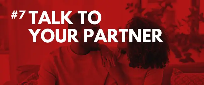 Couple having an intimate conversation on a couch with bold text “Talk to Your Partner,” illustrating communication’s role in boosting sex drive
